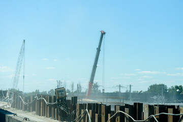 Temporary sheet pile cofferdam retaining wall at the construction site. Russia, Saint Petersburg, June 23, 2020: