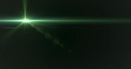 Glowing green spot of light moving against black background