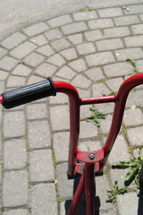 Red old and rysty scooter