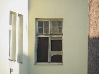 old wooden window with broken glass
