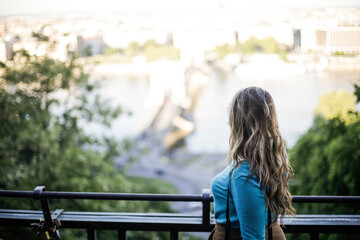 A woman is looking a view