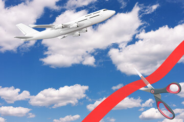 Obraz na płótnie Canvas Opening Flights After COVID-19 Quarantine Concept. Scissors Cutting Red Ribbon in Front of Blue Cloudy Sky with White Modern Passenger Airplane. 3d Rendering