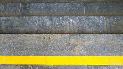 Close-up steps with a bright yellow protective line