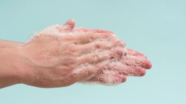 Stop motion animation of man washing hands isolated on blue