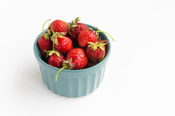 strawberries in a bowl on a white background