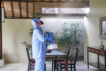 Cleaning and disinfecting: Key weapons in the fight against contagious diseases. Spray disinfection of surfaces in the house.
Fogging with disinfectant due to coronavirus.

