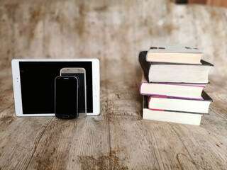 Books vs smartphones. Technology or books ?. Traditional or modern information? Comparison © Jose Prieto