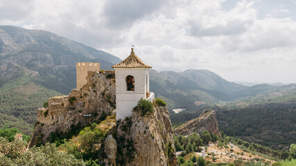 Fototapeta na wymiar Belltower in Guadalest, Alicante, Spain. Panoramic view.