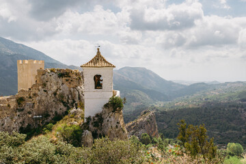Fototapeta na wymiar Old bell tower on the top of the rock, Castell de Guadalest, Alicante, Spain