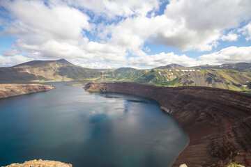 Daytime view in clear sunny weather of the flooded caldera of the volcano