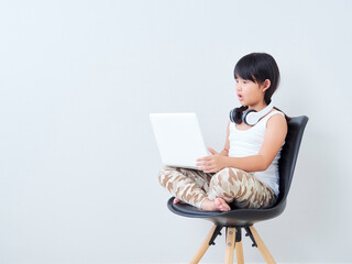 Little girl study online with laptop.