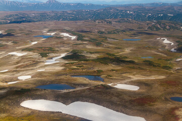 Daytime view in clear sunny weather of hills, rivers, mountains, forests, mountainous terrain.