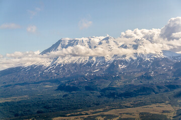 Daytime view in clear sunny weather of the snow-capped mountain peaks