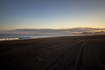 Fototapeta premium View of the Pacific coast during a sunny sunset on a clear sunny day.