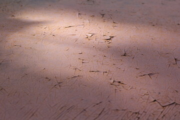 Blurred crack, peeling paint or rust on a car texture background