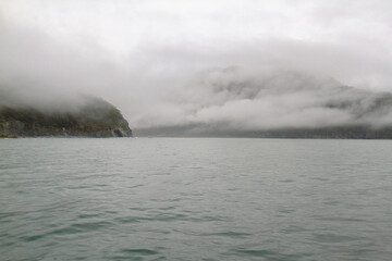 Naklejka premium View of the sea bay during bad weather, fog, rain, strong wind