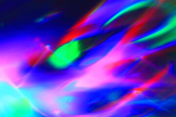 A abstract color image of a burst of blue, red, pink, green, black and white color with no people and has free space for text.