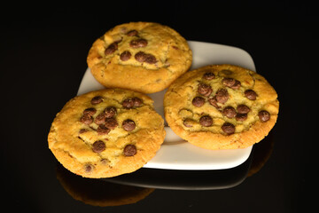 Homemade cookies with chocolate, close-up, on a white background.