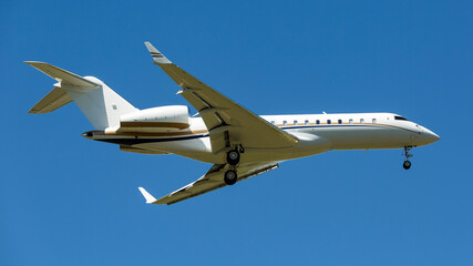 White business jet plane in the sky