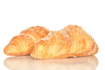 Homemade croissants, close-up, on a white background.
