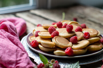 mini pancakes with fruits on a plate