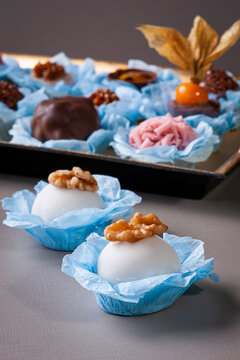 .Various types of gourmet brigadeiro on a golden tray. Cameo highlighted. Typical sweet from Brazil with condensed milk and chocolate.