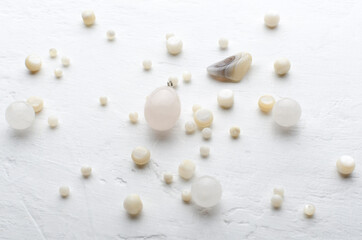 Closeup of decorative white beads on the bright surface