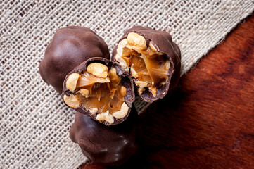 .A type of brigadeiro called Charge, with dulce de leche and peanuts. Party candy. Top view