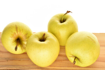 Yellow apples, close-up, on a white background.