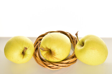 Yellow apples, close-up, on a white background.