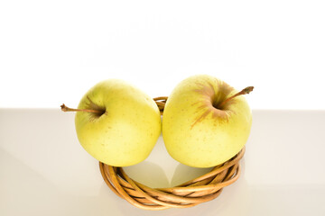 Yellow apples, close-up, on a white background.