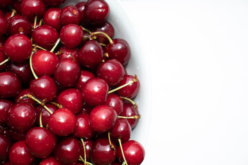 Fresh sweet cherries on white background.