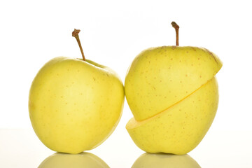 Yellow apples, close-up, on a white background.