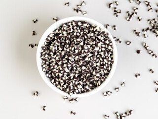 Two toned chocolate chip on white bowl.
