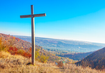 Christian Wooden Cross on the Hill Top . Religious Symbol of Christianity 