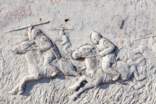 Stone engraving from the Dacian period . Ancient art with warriors