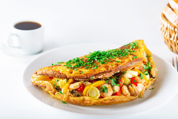 Hot breakfast. Omelette with seafood and vegetables.