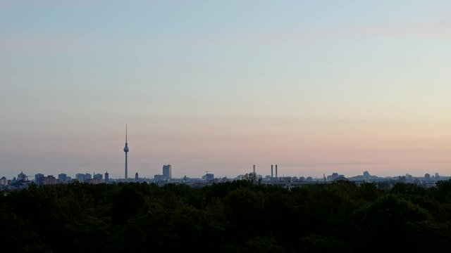 Park and cityscape at dusk, Berlin, Germany
