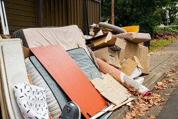 Household miscellaneous rubbish items put on curbside for council waste collection © Daria Nipot