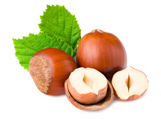 hazelnuts with green leaf isolated on white background