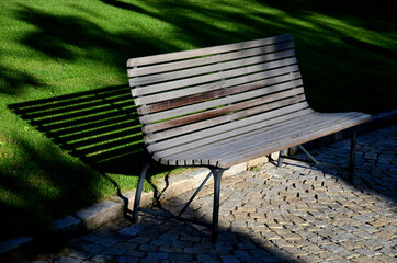 garden park bench metal comfortable with construction with ergonomic curves of thin wood slats...