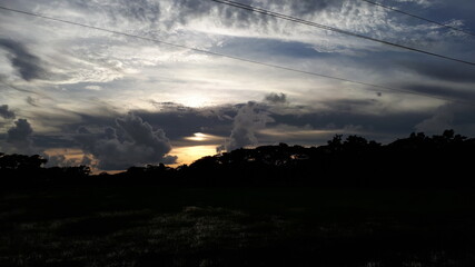 time lapse clouds over sunset