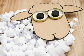 Paper sheep for children. DIY toy. Activity at home. Early education, fine motor skills. Montessori methodology.