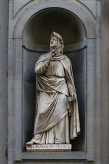 Statue of Francesco Petrarca, famous italian poet, outdoor the uffizi museums, Florence, Italy