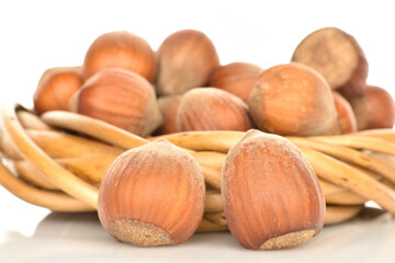 Hazelnuts, macro, on a white background.