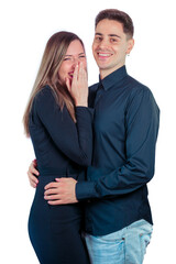 Young couple laughing on a white background