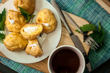 Custard cookies and coffee, eclair