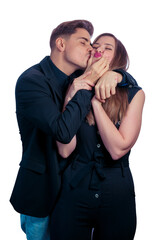 Young couple hugging and kissing on a white background