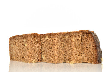 Slices of black cereal bread, close-up, on a white background.
