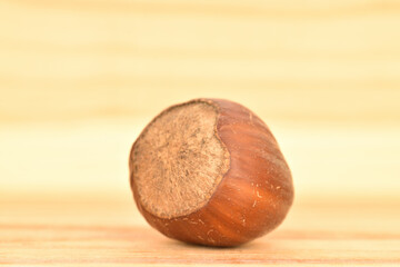 Hazelnuts, macro, on a background of natural wood.